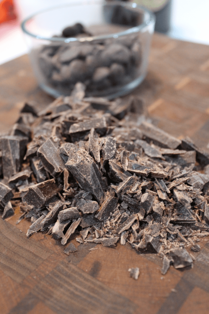 cutting board with chopped chocolate and weighed chips