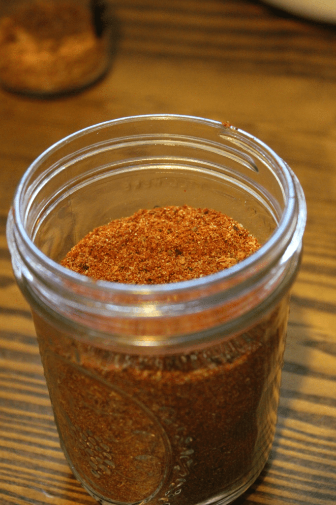 open lid mason jar with taco seasoning