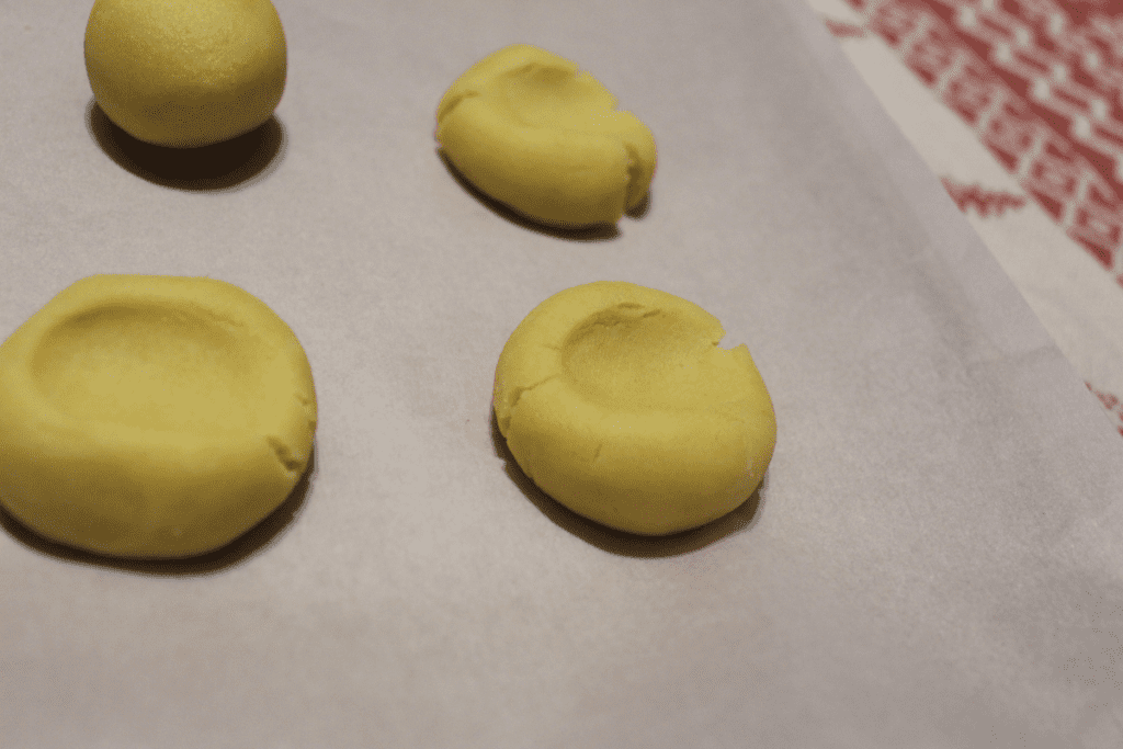 Press dough balls with thumb