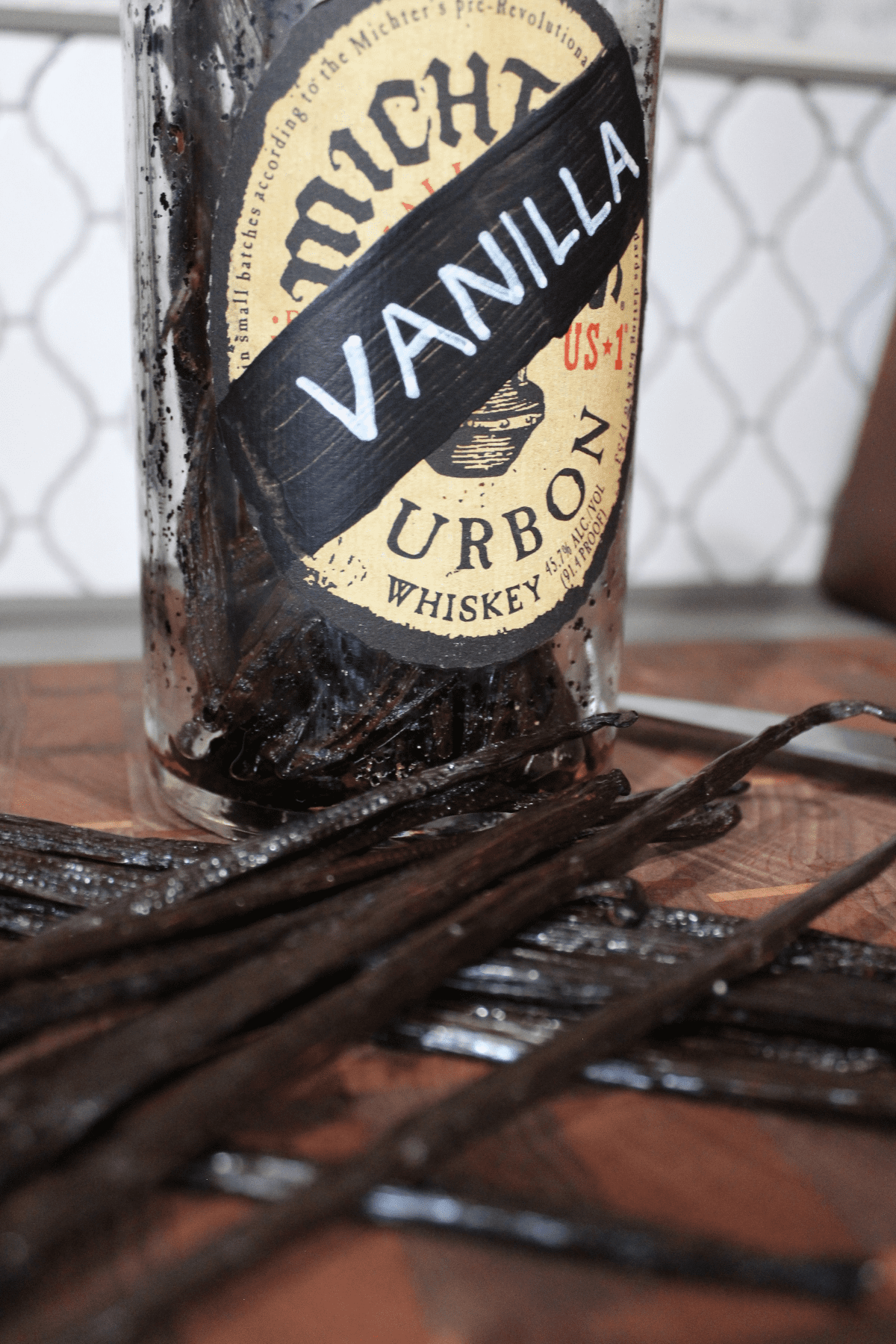 Vanilla Beans and Bottle on Cutting Board